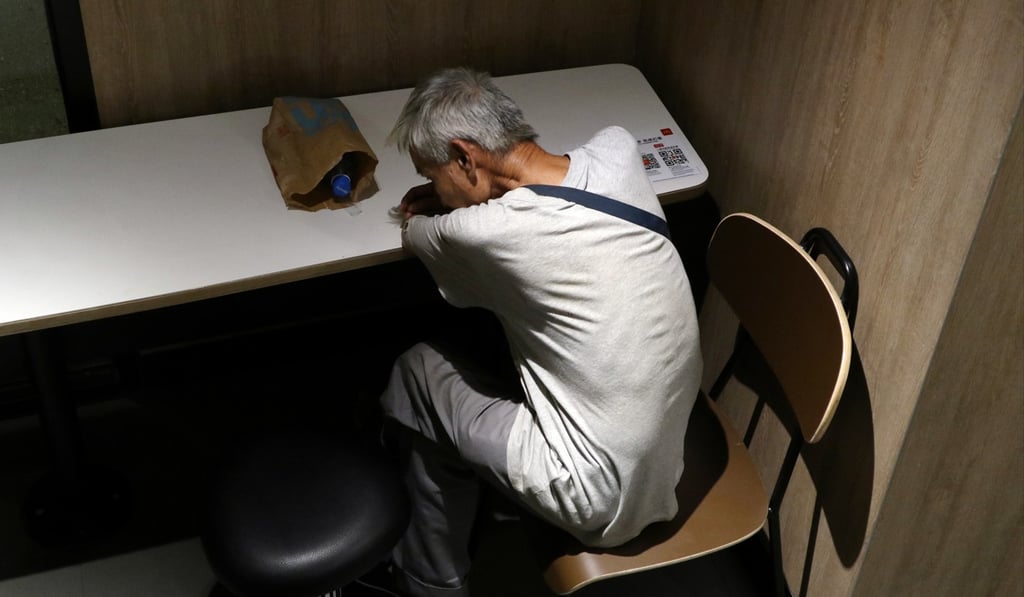 A “McRefugee” in Sham Shui Po, in August 2018. A survey found that the number of Hong Kong people sleeping in McDonald’s outlets had increased sixfold over the past five years. Photo: Roy Issa