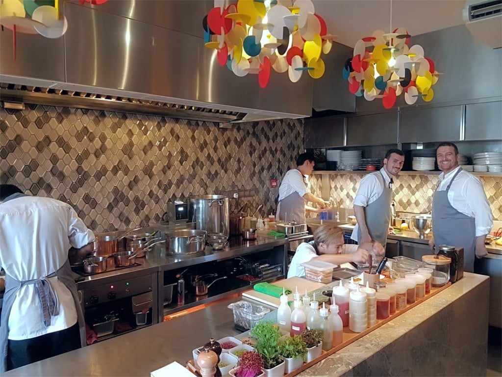 Braci’s Beppe de Vito (far right) and head chef Mirko Febbrile (second right) in the kitchen at the restaurant which has retained its one-star rating in the ‘Michelin Guide Singapore’. Braci’s Beppe de Vito (far right) and head chef Mirko Febbrile (second right) in the kitchen at the restaurant which has retained its one-star rating in the ‘Michelin Guide Singapore’.