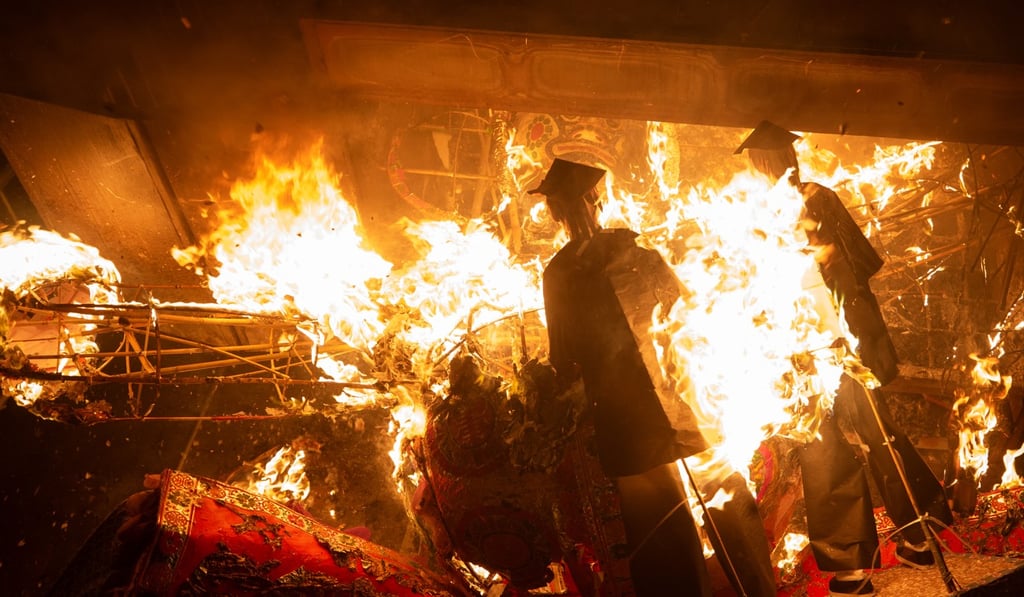 The burning of a giant paper offering during the Hungry Ghost Festival, photographed in Shau Kei Wan. The offerings are supposed to ‘feed’ ancestors and satisfy hungry ghosts. Photo: Winson Wong