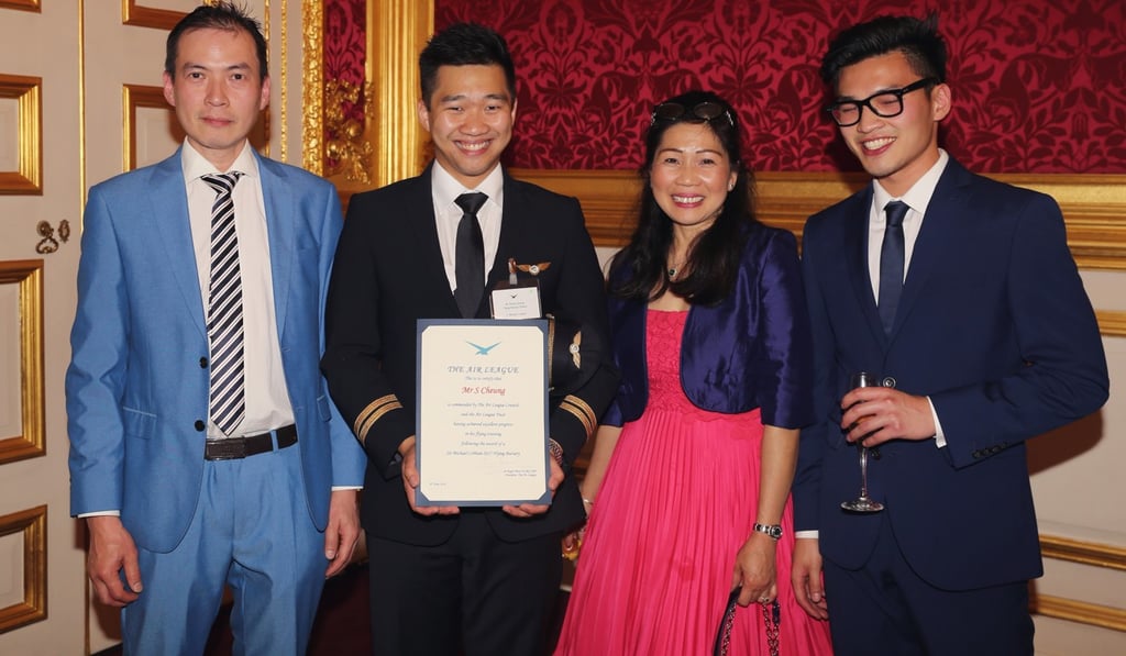 Cheung (second from left) gets his certificate from The Air League. Photo: Handout