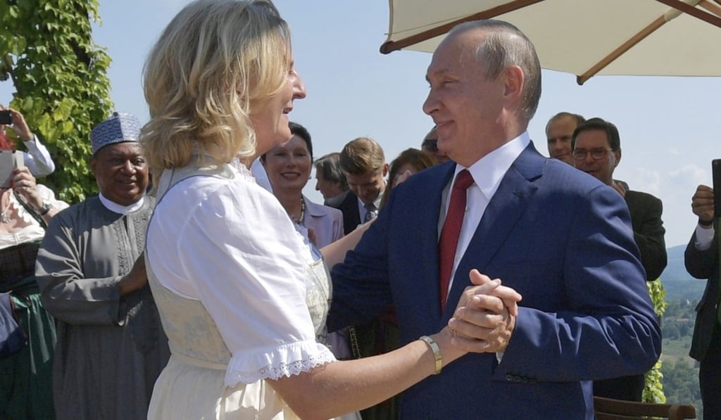Russian President Vladimir Putin, right, dances with Austrian Foreign Minister Karin Kneissl as he attends her wedding to Austrian businessman Wolfgang Meilinger in Gamlitz, southern Austria, on Saturday. Photo: AP Russian President Vladimir Putin, right, dances with Austrian Foreign Minister Karin Kneissl as he attends her wedding to Austrian businessman Wolfgang Meilinger in Gamlitz, southern Austria, on Saturday. Photo: AP