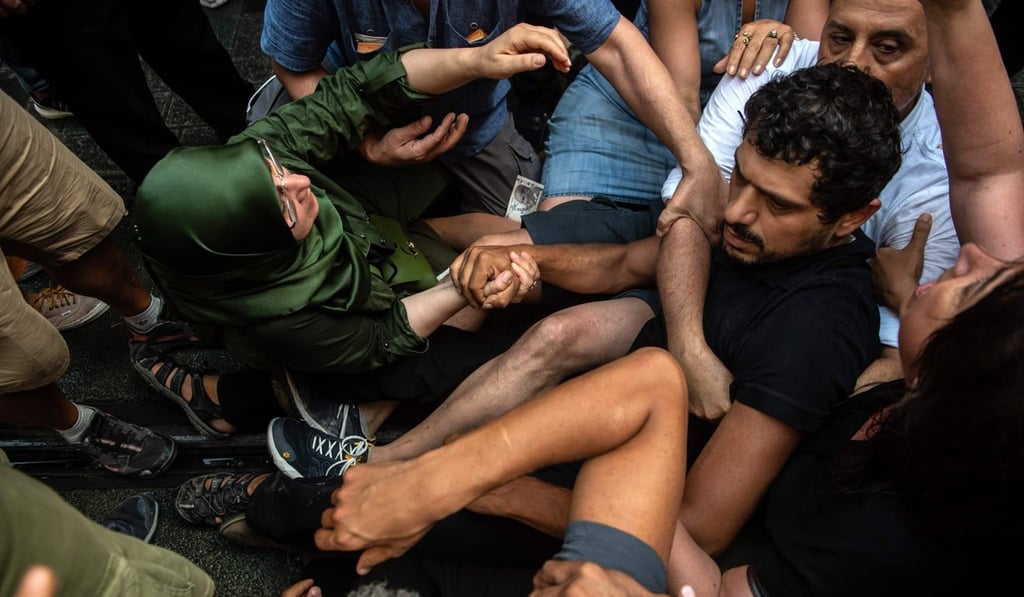 Turkish riot police detaining protesters on Saturday in Istanbul. Photo: AFP