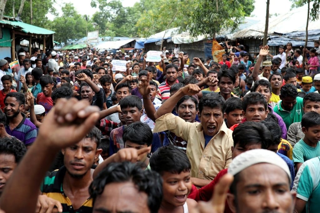 Rohingya refugees shout slogans as they take part in a protest at the Kutupalong refugee camp to mark the one year anniversary of their exodus in Cox's Bazar, Bangladesh. Photo: Reuters