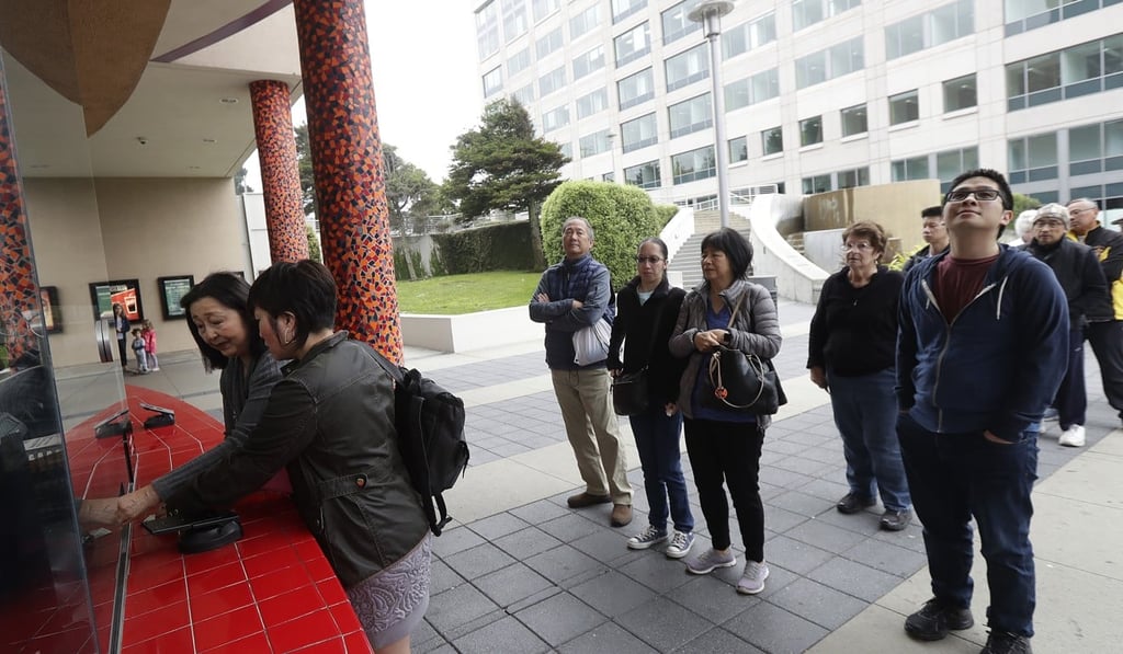 Movie-goers buying tickets for Crazy Rich Asians in Daly City, California, last week. Photo: AP Movie-goers buying tickets for Crazy Rich Asians in Daly City, California, last week. Photo: AP