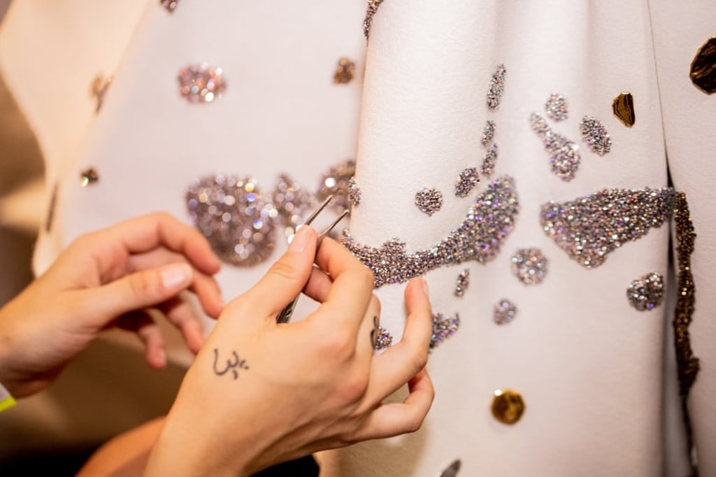 Backstage preparation during Viktor & Rolf’s autumn/winter haute couture show. Photo: Kevin Tachman