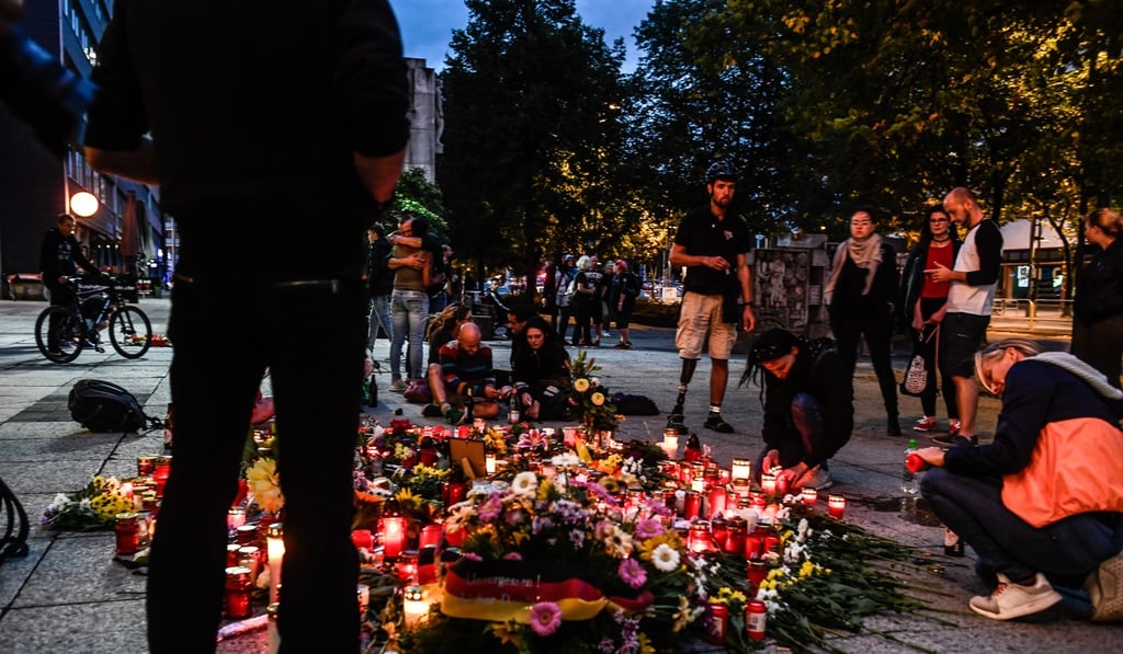 Flowers and candles at the place where a man was stabbed on August 25, 2018, in Chemnitz, Germany. Photo: EPA Flowers and candles at the place where a man was stabbed on August 25, 2018, in Chemnitz, Germany. Photo: EPA