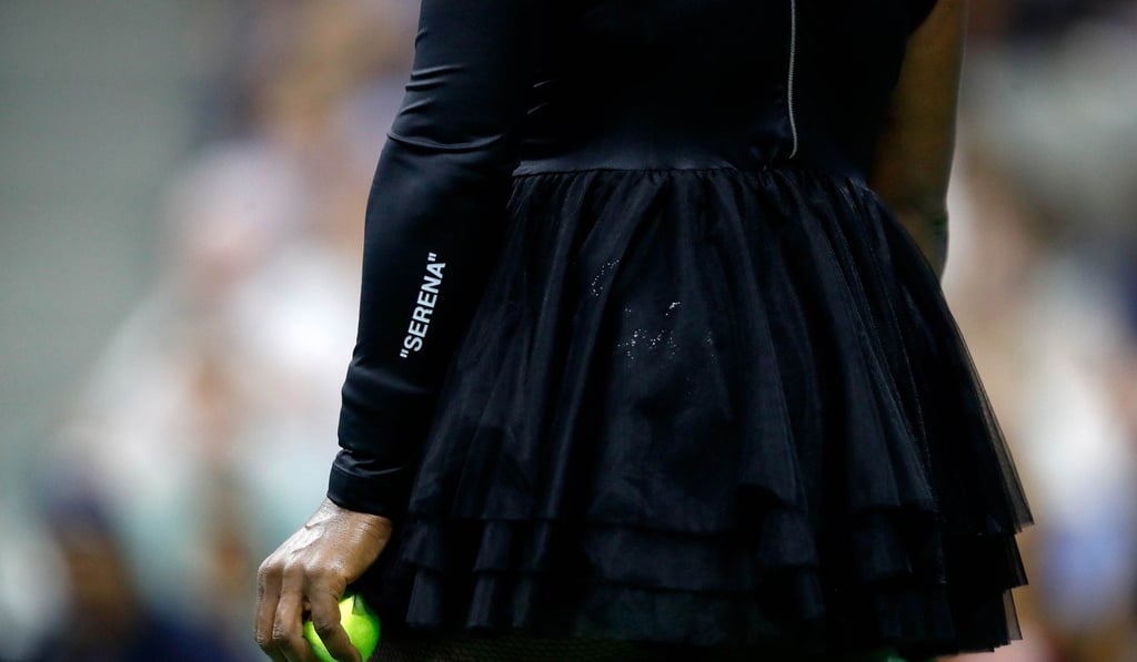 Williams prepares to serve, with the “Serena” detailing of her outfit visible. Photo: AFP
