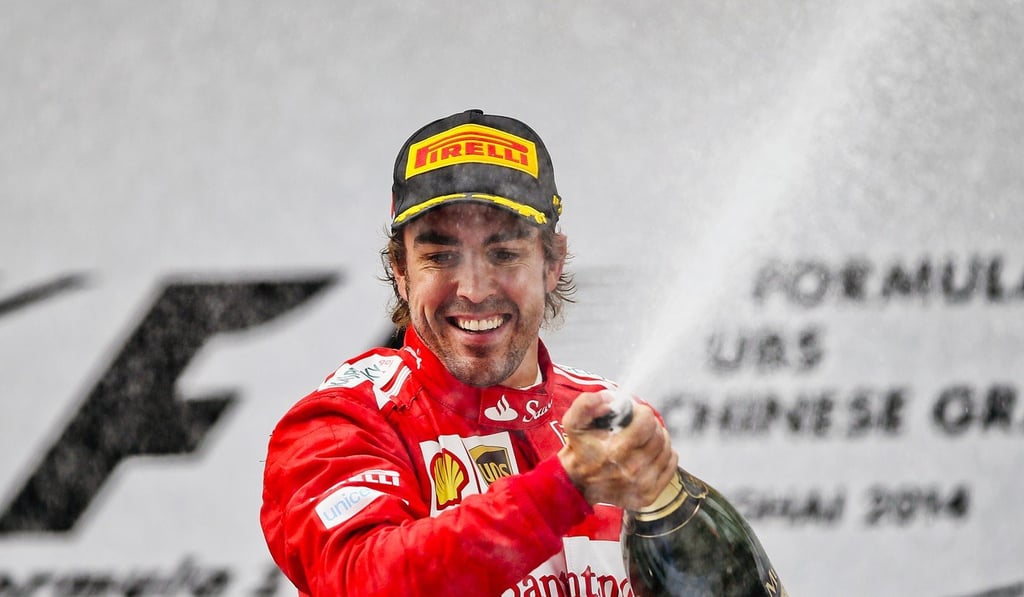 Third placed Spanish Formula One driver Fernando Alonso of Scuderia Ferrari celebrates on the podium after the Chinese Formula One Grand Prix. Photo: EPA