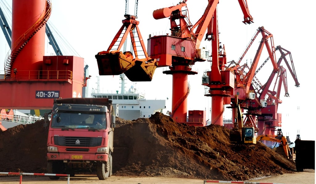 Excavators load rare earth onto trucks at Lianyungang port, in the eastern Chinese province of Jiangsu. Photo: Imaginechina.