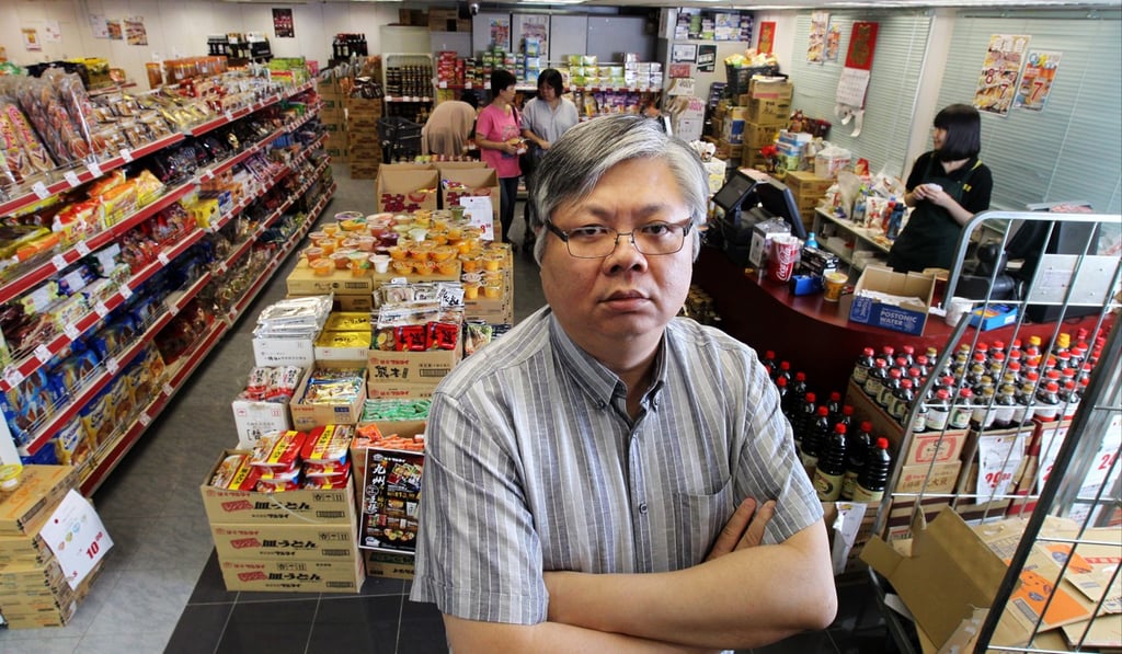 Coils Lam Wai-chun, chairman and managing director of CEC International Holdings Limited, at a 759 store in Kwun Tong in July 2013. Lam, who died this month, gained attention for his battle to keep the prices in his stores low. Photo: Dickson Lee