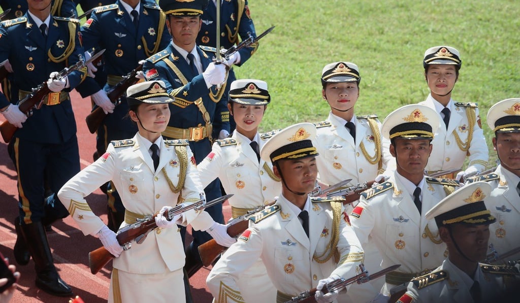 People’s Liberation Army soldiers at a naval base event in Hong Kong. Photo: K.Y. Cheng