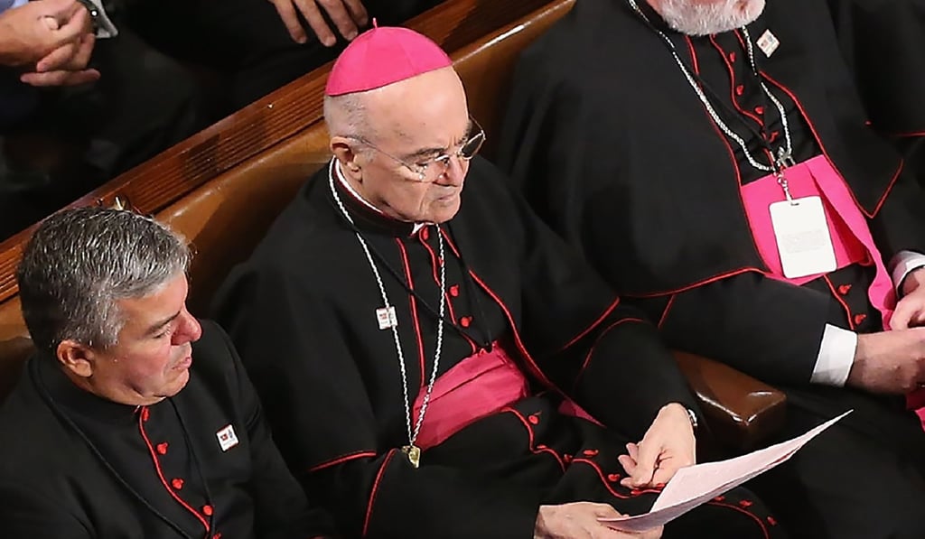 In this file photo taken on September 24, 2015, papal nuncio in Washington Archbishop Carlo Maria Vigano (centre) sits among Catholic clergy and members of Congress as Pope Francis addresses a joint meeting of the US Congress in the House Chamber of the US Capitol in Washington. Photo: Agence France-Presse