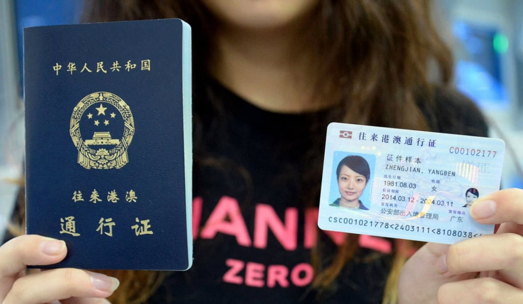 A model displays a Chinese passport and mainland ID card, similar to the one that will be issued to Hong Kong, Macau and Taiwan residents. Photo: Weibo