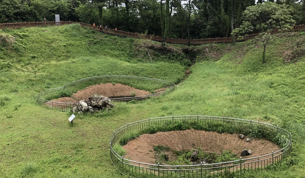 Craters believed to be the site of massacres in the late 1940s and early 1950s. Photo: Steven Borowiec