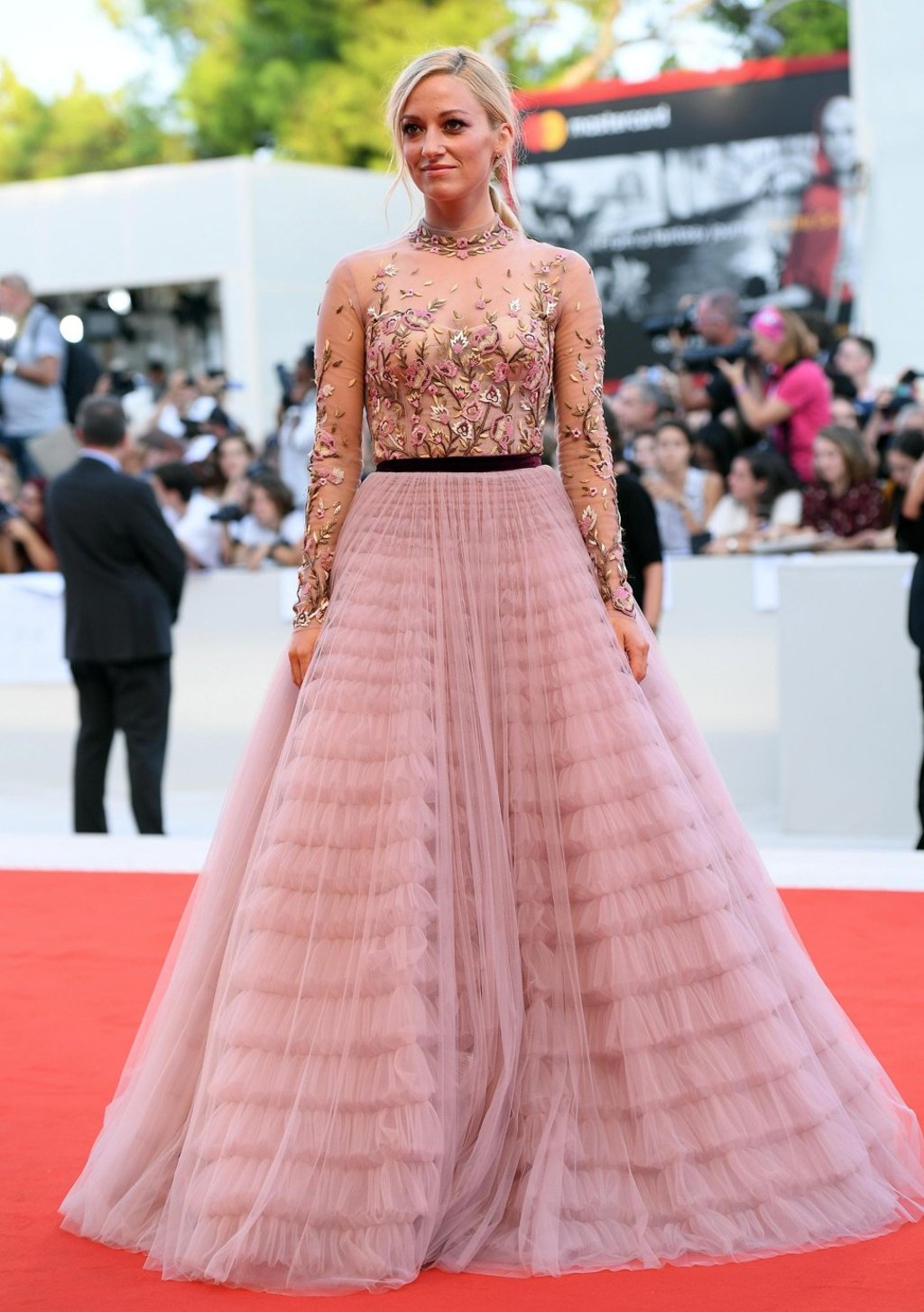 Britain’s Olivia Hamilton, who also has a role in ‘First Man’, opted for a long dress in a pale shade. Photo: EPA-EFE