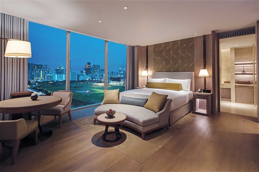 A deluxe bedroom at the Waldorf Astoria Bangkok.