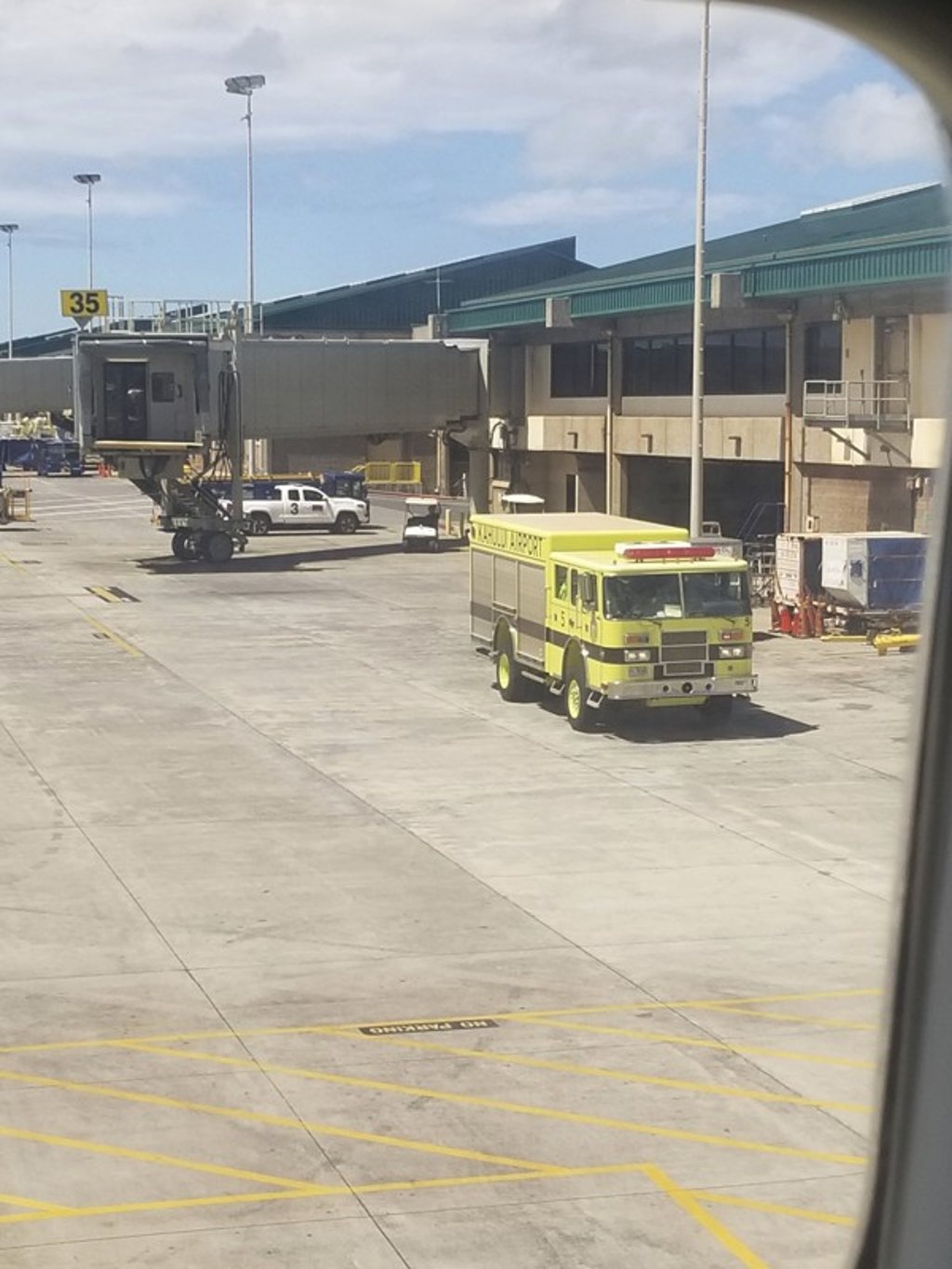 A fire truck outside the Hawaiian Airlines jet in Kahului, Hawaii. Photo: AP/Nicholas Andrade