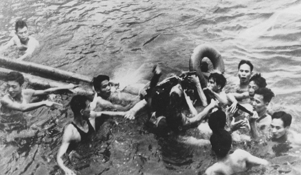 John McCain is pulled out of a Hanoi lake by North Vietnamese Army soldiers and Vietnamese citizens in October 1967. Photo: Reuters
