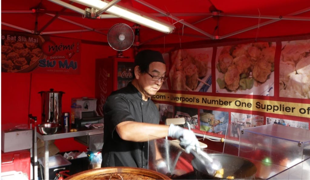 A street food seller in Liverpool Chinatown cooks Siu Mai. Photo: Hilary Clarke