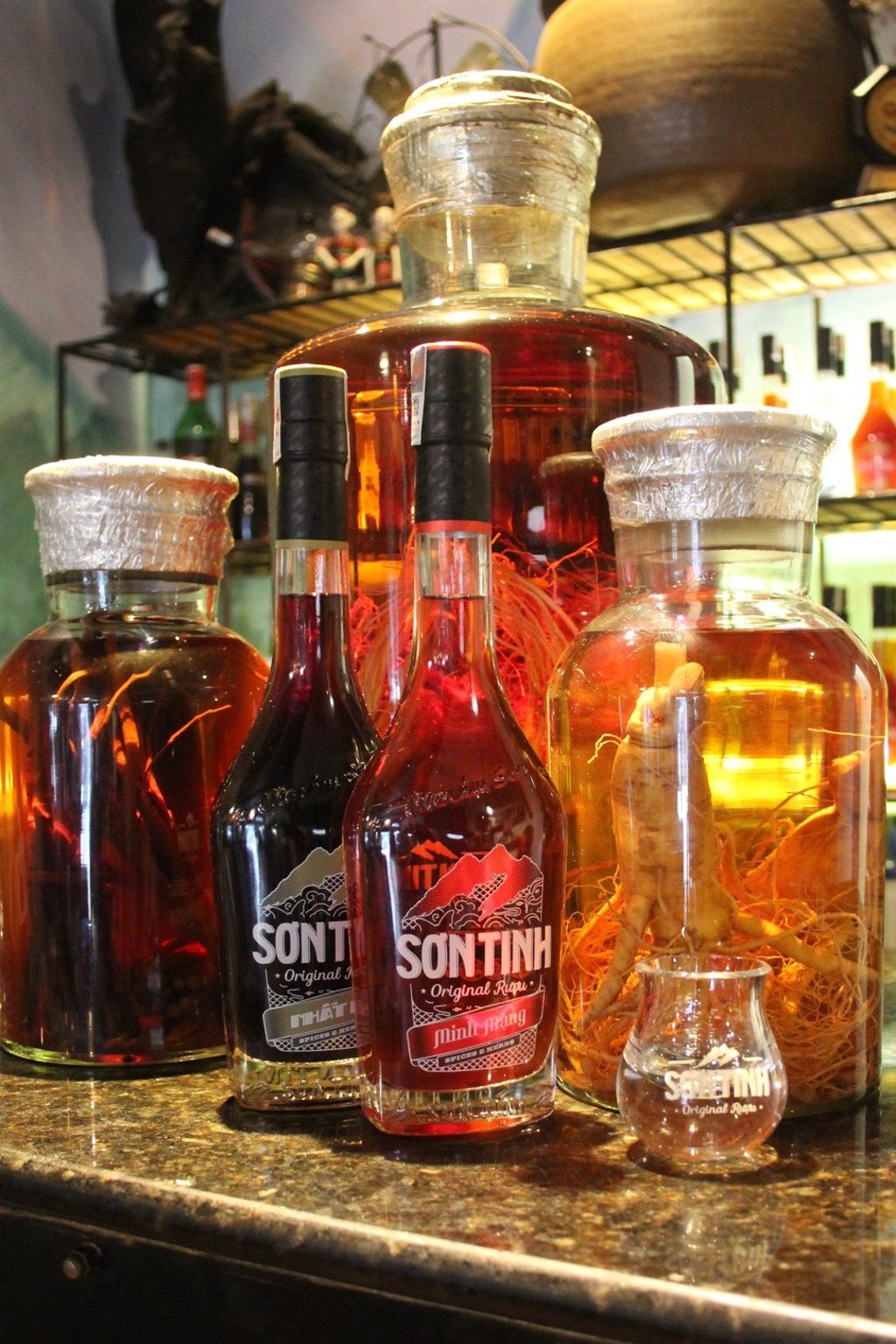 Bottles of Vietnamese rice liquor brand Son Tinh, which doesn’t use animal parts, on display at restaurant Highway4 in Hanoi, Vietnam. Photo: Anemi Wick