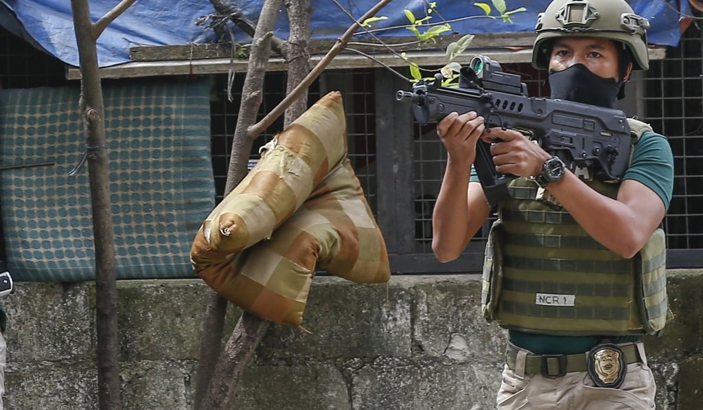 A member of the Philippine Drug Enforcement Agency, armed with an Israeli-made ‘Tavor’ submachine gun. File photo: EPA