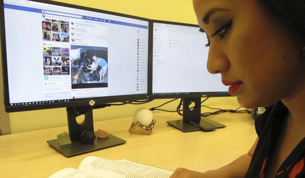 Britt'Nee Brower working in Anchorage, Alaska, with the new Inupiat Eskimo language option now available for Facebook bookmarks and action buttons. Photo: AP