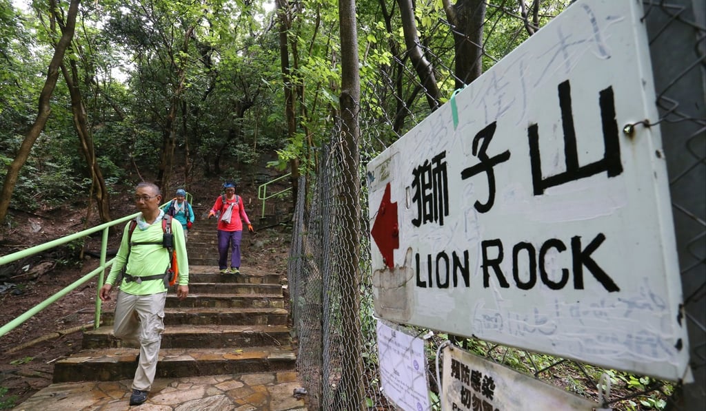 Hikers take the trail next to the Lion Rock Park, which is closed because of the dengue fever outbreak in the area. Photo: Dickson Lee