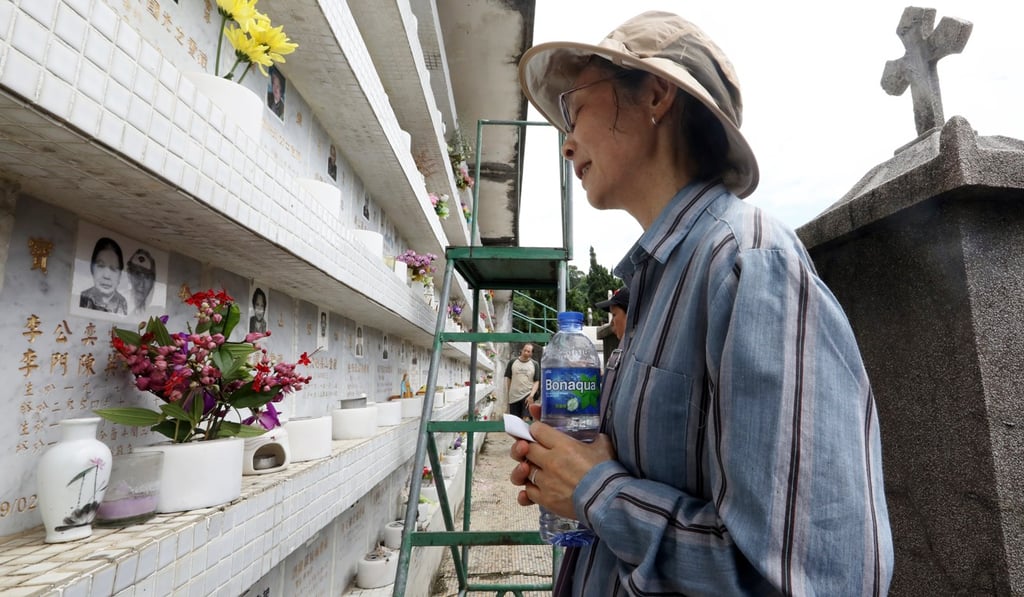 Lisa Chung visited her husband’s niche at St Raphael’s on Monday to see if it had been one of those affected. Photo: Dickson Lee