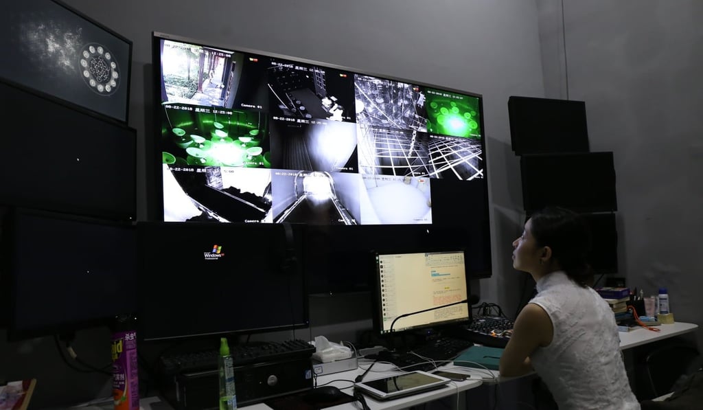 Shan Qi, director of Xinglai Museum, monitors participants’ experience through surveillance cameras. Photo: Rachel Cheung