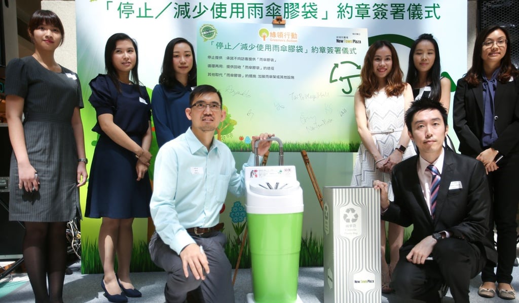 Greeners Action launches a charter for reducing the use of plastic covers for wet umbrellas, at New Town Plaza in October 2016. Photo: Xiaomei Chen