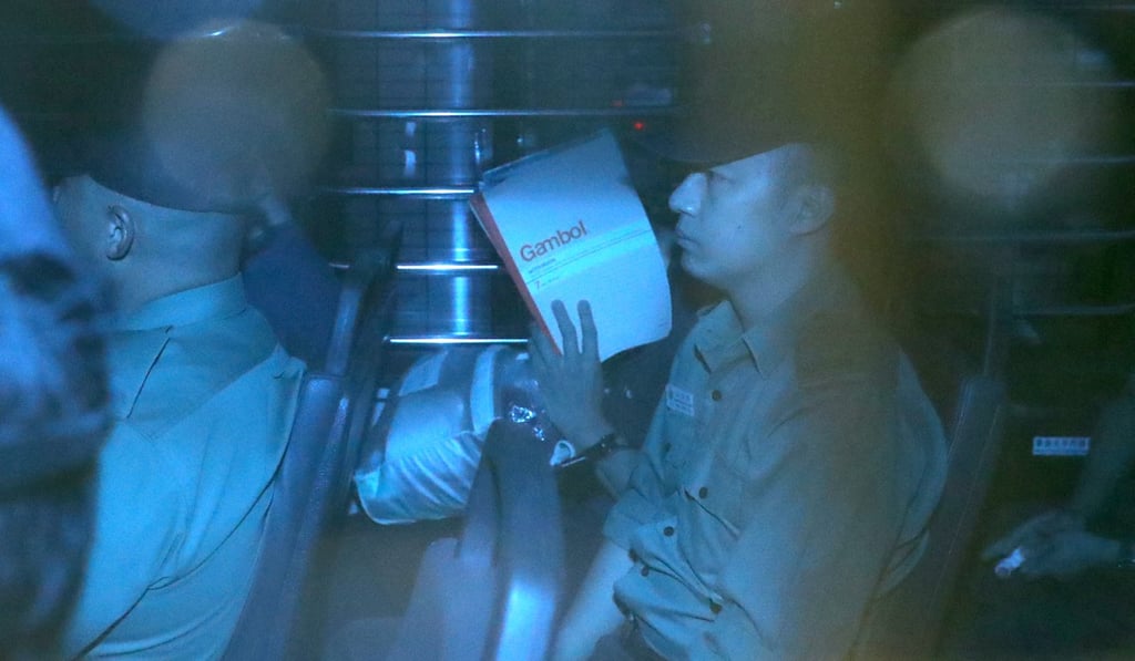 Khaw Kim Sun (centre, covering his face), is escorted by the Correctional Services Department to the High Court in Admiralty. Photo: Winson Wong