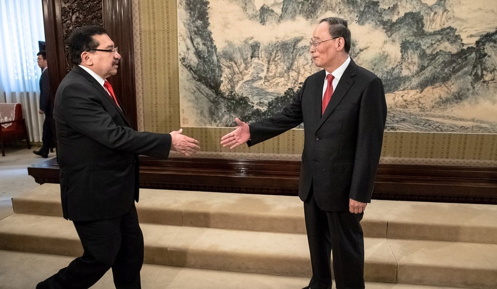 Medardo Gonzalez, a Salvadoran politician, greeting Chinese Vice President Wang Qishan in Beijing, China, last month. China’s growing sway in Latin America is a boon for students. Photo: Reuters