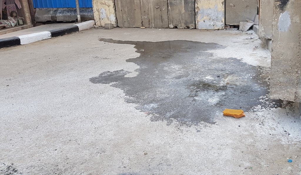 The scene where a bottle containing flammable chemicals caught fire in a man's backpack on Tuesday near the US embassy in Cairo. Photo: Reuters