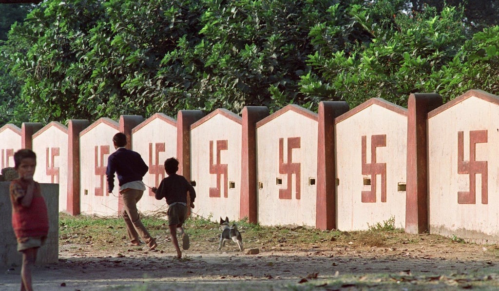A wall covered with swastikas, a symbol of Hinduism, in Ayodhya. Photo: AFP A wall covered with swastikas, a symbol of Hinduism, in Ayodhya. Photo: AFP