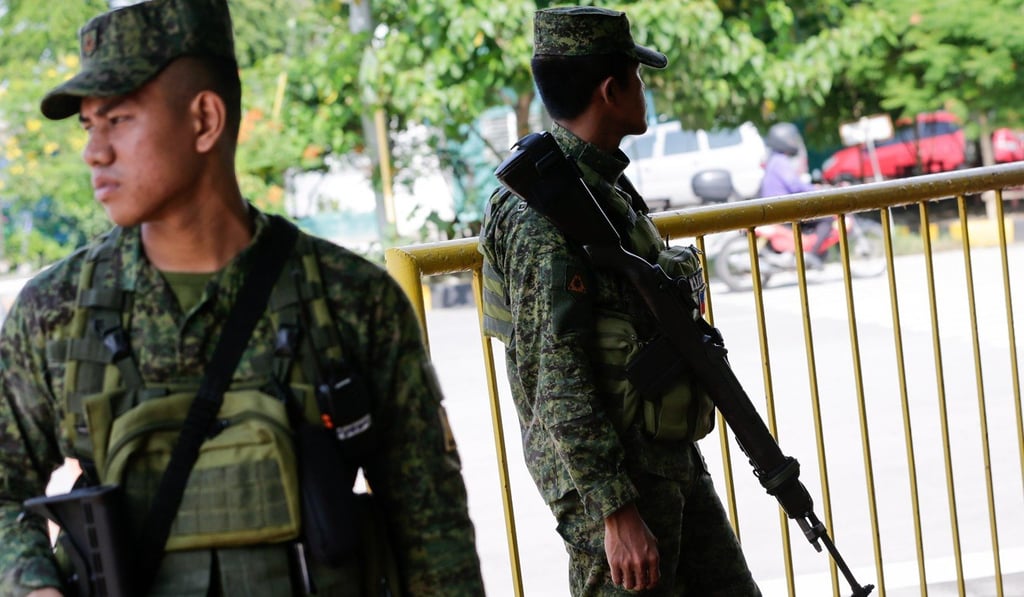 Military police outside the Philippine Senate in Manila. Photo: EPA