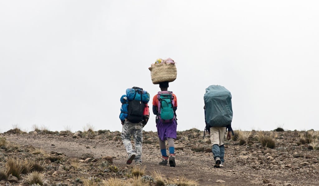 Porters carry camping equipment, water, medical supplies and more up the mountain. Picture: Shutterstock