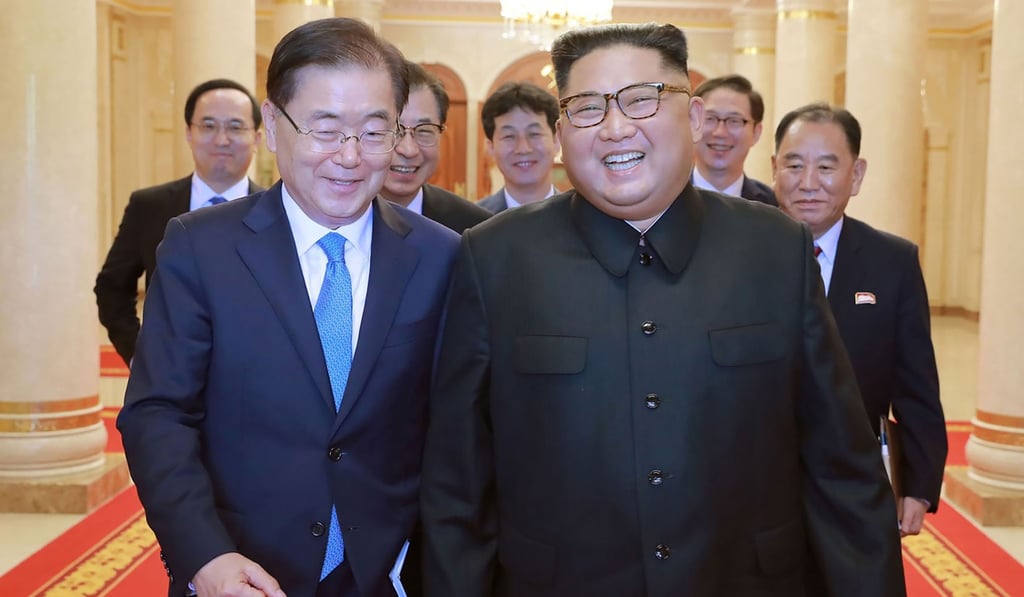 Kim Jong-un with South Korean envoy Chung Eui-yong (left) in Pyongyang. Photo: AFP