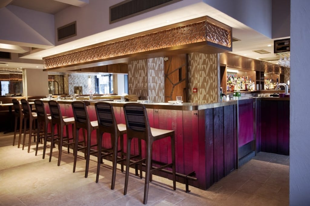 There is a semi-open kitchen that looks onto the main dining space at BEDU. There is a semi-open kitchen that looks onto the main dining space at BEDU.