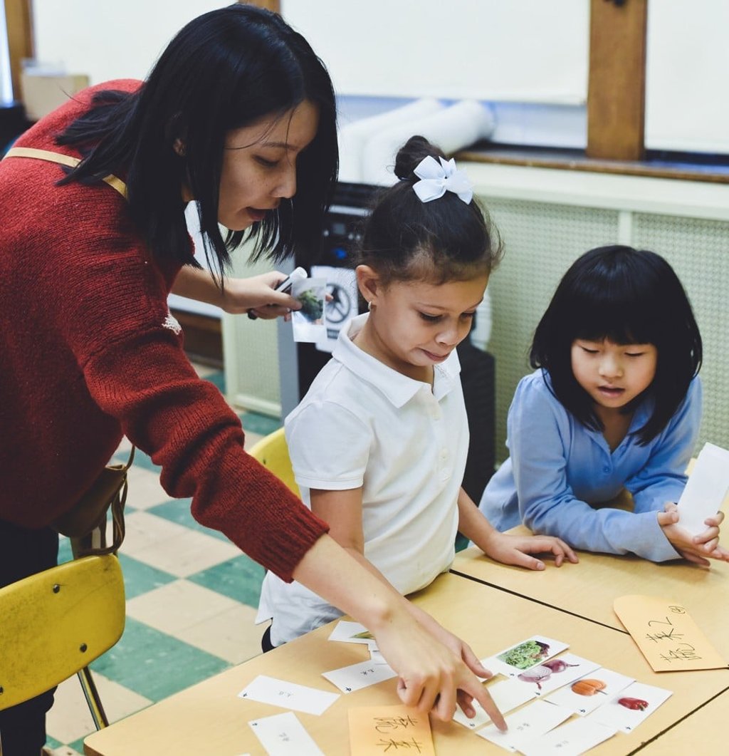 Teacher Yuting Huang helps students learn the Mandarin names of vegetables at Global Ambassadors Language Academy in Cleveland. Photo: Meran Rogers/Global Ambassadors Language Academy