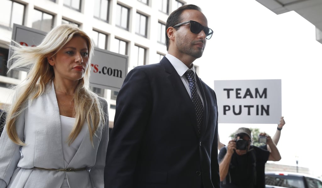 Former Donald Trump campaign foreign policy adviser George Papadopoulos, holds hands with his wife Simona Mangiante as they arrive for his sentencing on Friday. Photo: AP