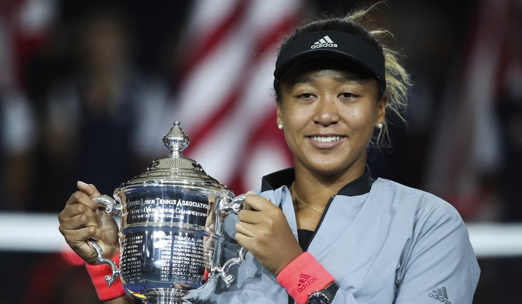 Naomi Osaka of Japan holds up the trophy. Photo: Xinhua Naomi Osaka of Japan holds up the trophy. Photo: Xinhua
