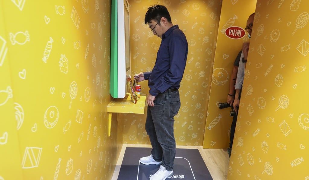 Customers can enter the shops by scanning a QR code with their mobile phone. Photo: Dickson Lee