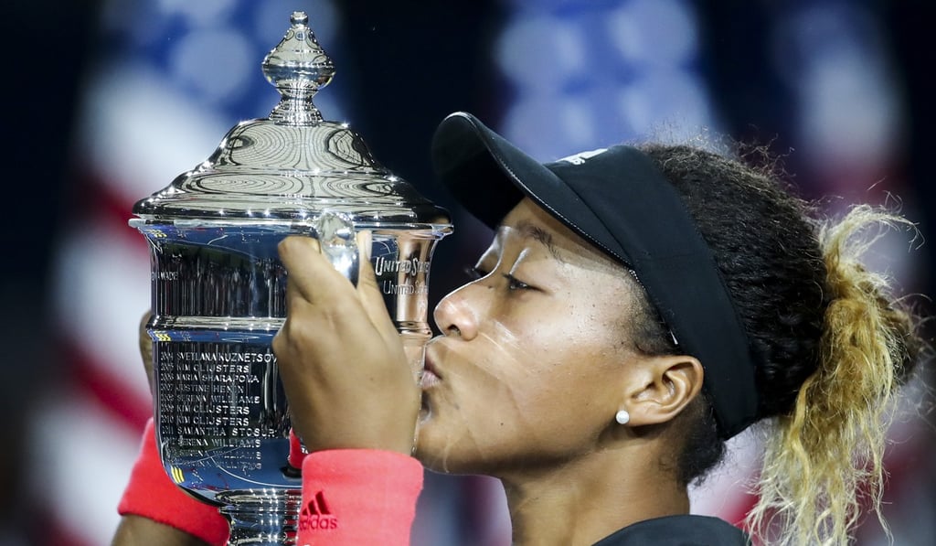 Osaka kisses the trophy after winning the women's singles final against Serena Williams. Photo: Xinhua Osaka kisses the trophy after winning the women's singles final against Serena Williams. Photo: Xinhua