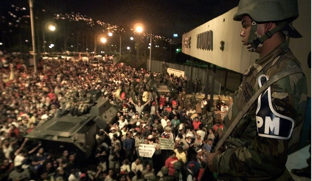 Thousands of Chavez supporters gather at a military base demanding his return to power on April 14, 2002. Photo: Reuters