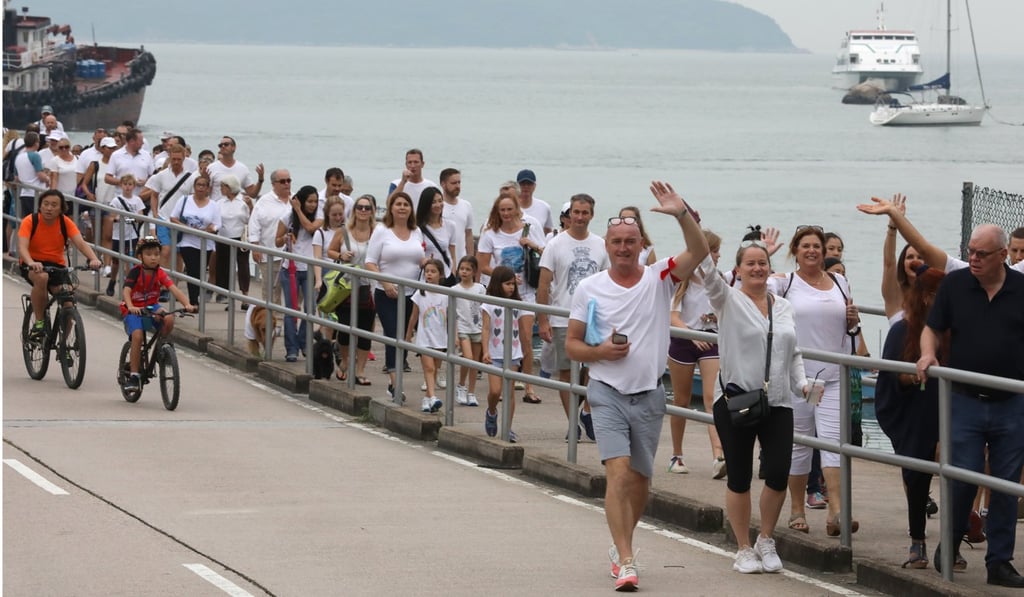 The protesters marched from Discovery Bay Marina Club to the community’s North Plaza. Photo: Nora Tam