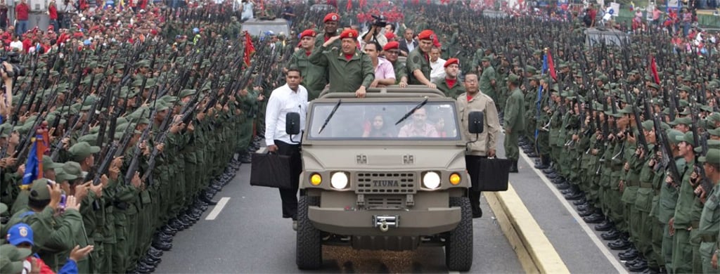 Chavez salutes the military as he arrives for a ceremony to commemorate the eighth anniversary of his return to power after the failed coup in Caracas on April 13, 2010. Photo: Reuters