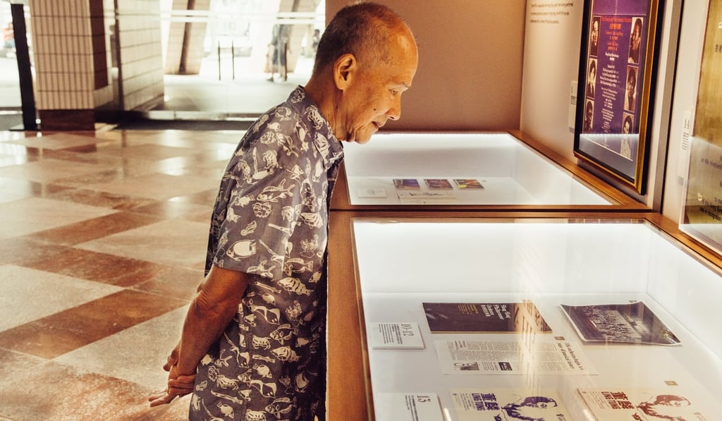 Steven Chan looks at an old newspaper report about the Hong Kong Philharmonic Orchestra in the ‘South China Morning Post’ at an exhibition at the orchestra’s ‘home’, the Hong Kong Cultural Centre, in Tsim Sha Tsui. Photo: Akif Hakan Celebi