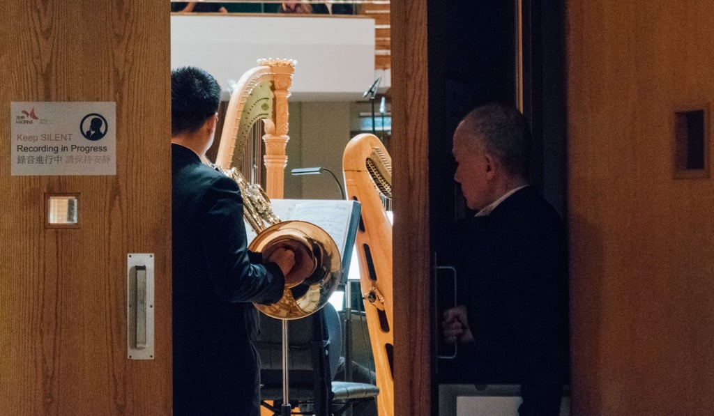 Stage manager Steven Chan (above) has many duties including checking on the lighting during performances, setting up things for rehearsals and performances, transporting instruments while on tour and looking after the needs of musicians. Photo: Phil Shek/HK Phil