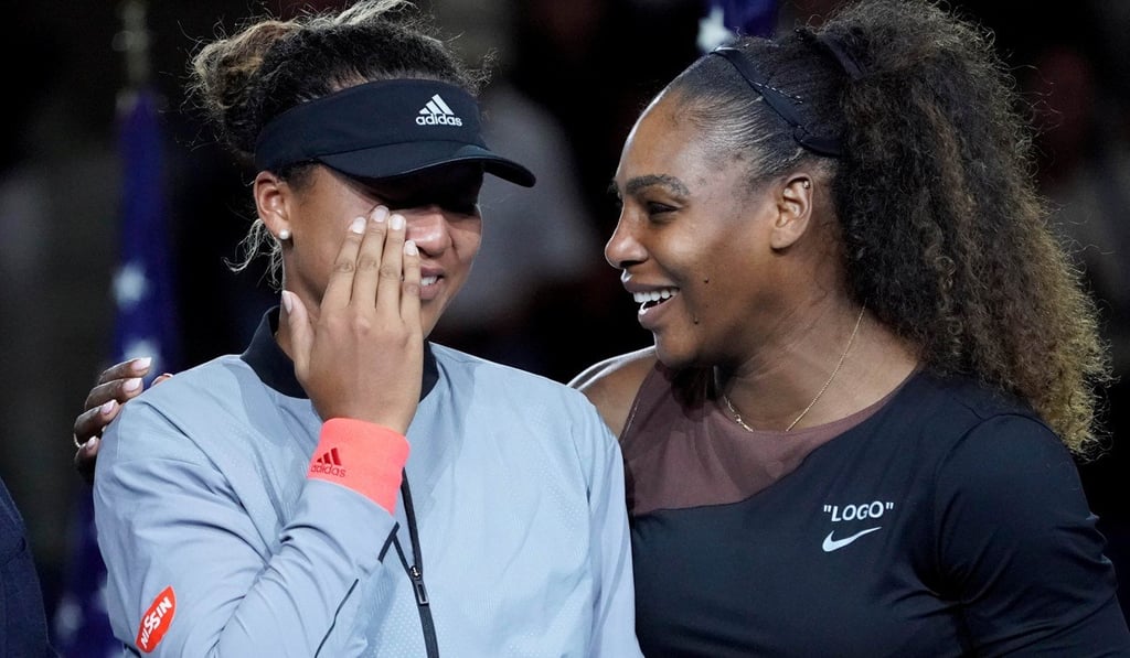Serena Williams comforts a tearful Naomi Osaka of Japan, as the crowd boos, during the trophy ceremony following their US Open singles final. Photo: USA TODAY via Reuters