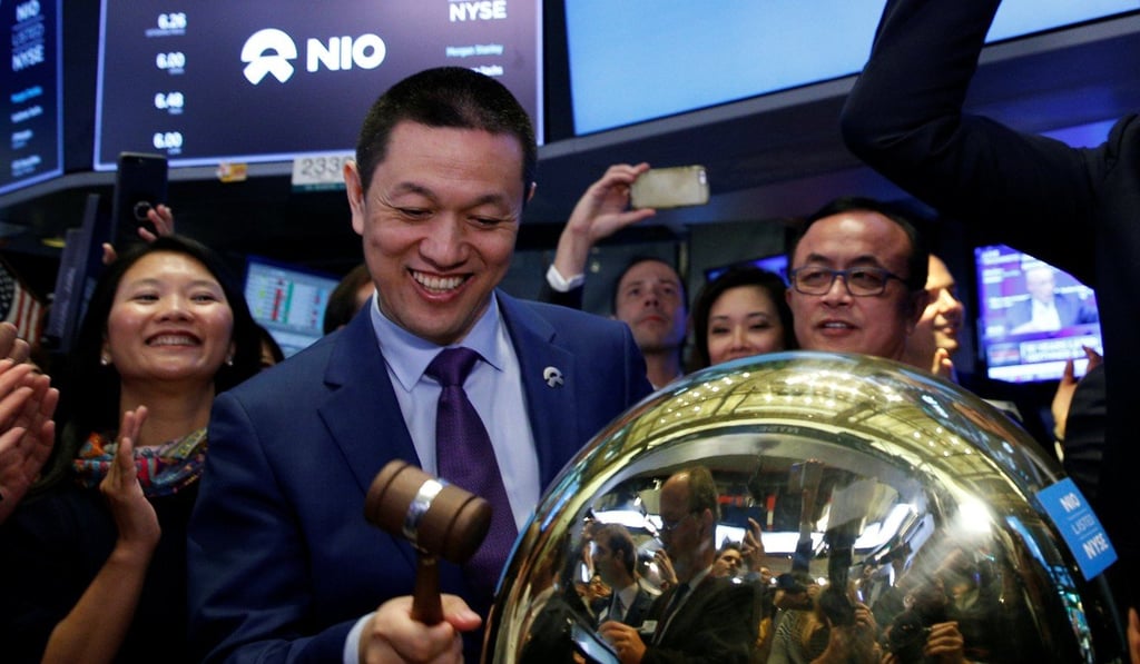 William Li, the chairman and chief executive of Nio, bangs the ceremonial bell as the company’s stock begins trading on the floor of the New York Stock Exchange during its initial public offering on Wednesday. Photo: Reuters